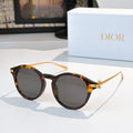 Round sunglasses with tortoiseshell frames and dark lenses