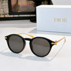 Round sunglasses with black frames and dark tinted lenses