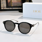 Round sunglasses with black frames and dark lenses