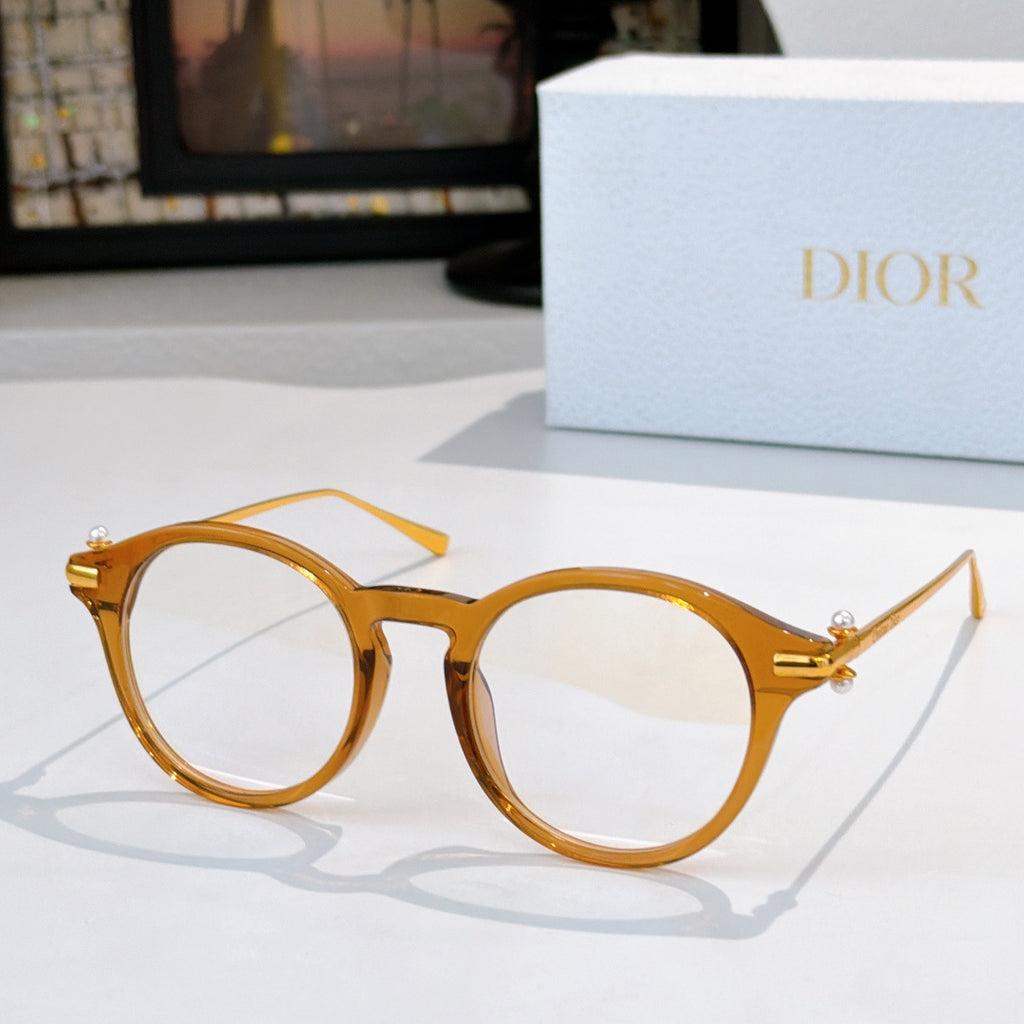 Round eyeglasses with amber frames and clear lenses