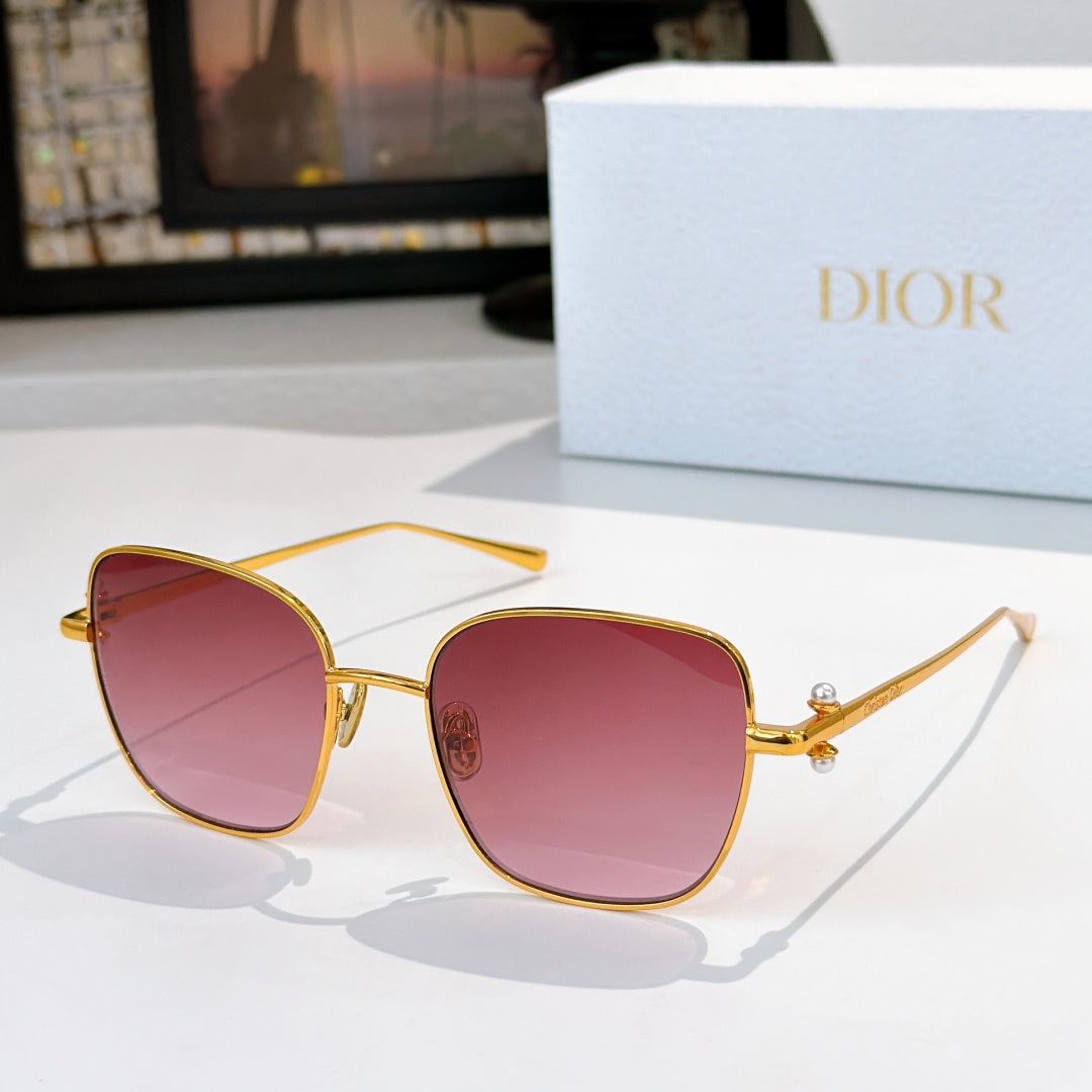 Gold-tone sunglasses with pink tinted lenses and slim angled temples