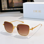 Gold-tone sunglasses with brown tinted lenses and slim angled temples