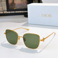 Gold-tone sunglasses with dark green mirrored lenses and slim temples