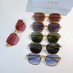 Assorted sunglasses with gold and dark frames, tinted lenses in red, green, blue, and black