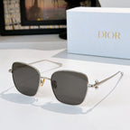 Silver-tone sunglasses with dark gray tinted lenses and slim temples