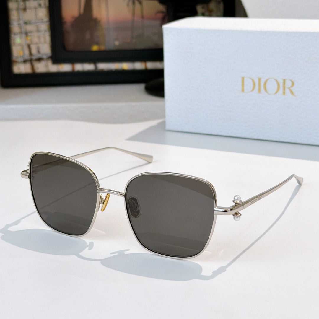 Silver-tone sunglasses with dark gray tinted lenses and slim temples