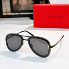 Dior sunglasses with black round frames and dark gray tinted lenses
