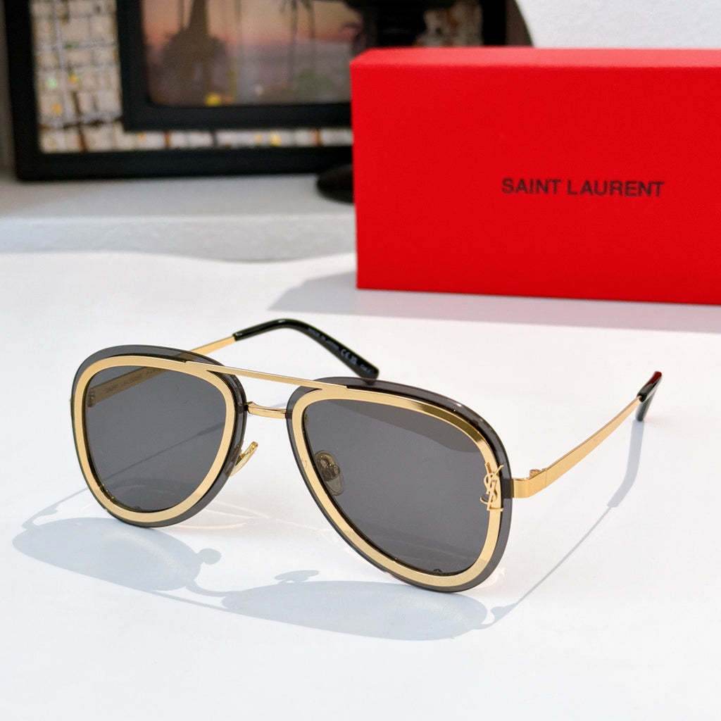 Dior sunglasses with gold and black frames and dark gray tinted lenses