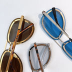 Dior sunglasses assortment with gold, brown, and blue frames