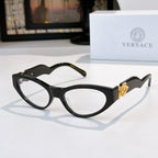Black cat-eye sunglasses with dark lenses and gold crest on temples