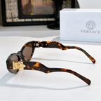 Tortoiseshell cat-eye sunglasses shown from the side with dark lenses