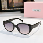 Cat-eye sunglasses with black frame and gradient tinted lenses