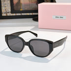 Cat-eye sunglasses with black frame and dark tinted lenses