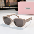 Cat-eye sunglasses with light beige frame and dark tinted lenses