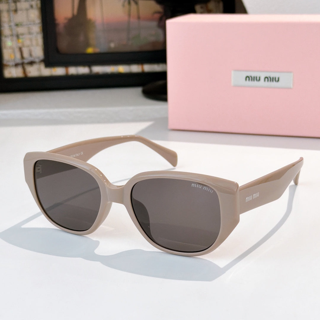 Cat-eye sunglasses with light beige frame and dark tinted lenses