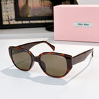 Cat-eye sunglasses with tortoise shell frame and dark tinted lenses