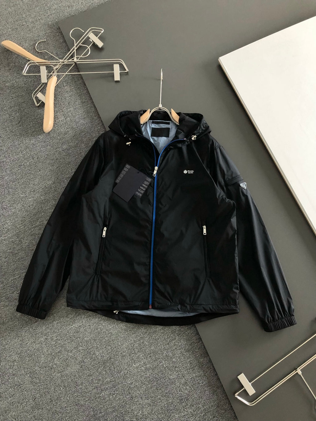 Prada black hooded jacket with front zipper and blue trim