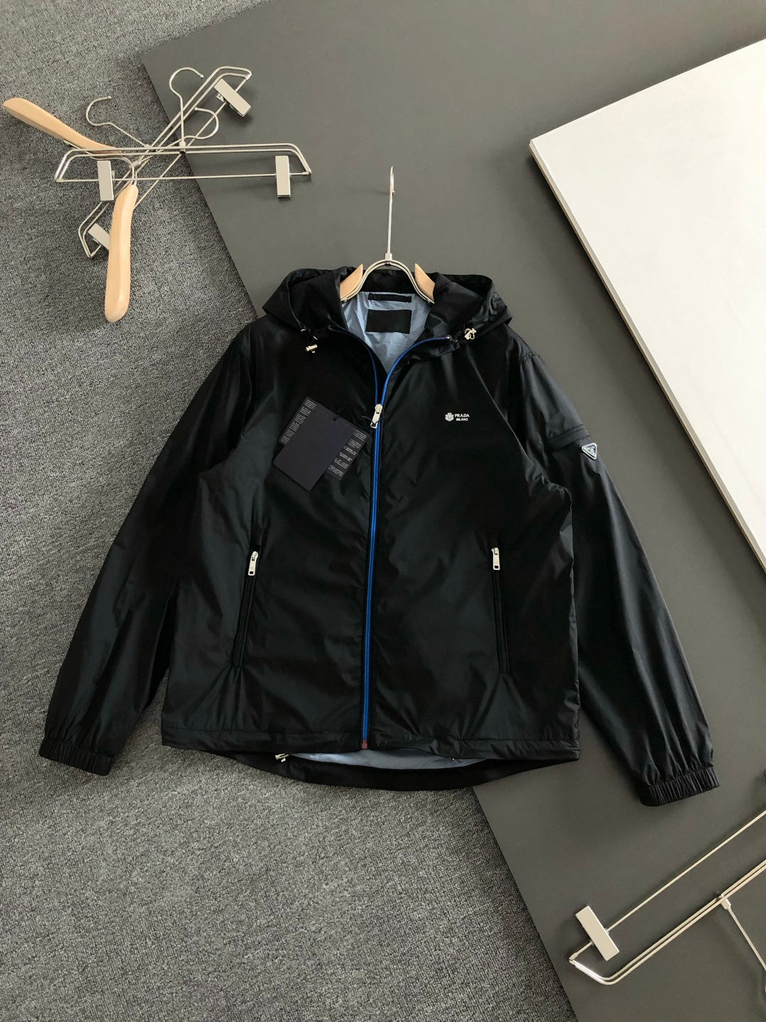 Prada black hooded jacket with front zipper and blue trim