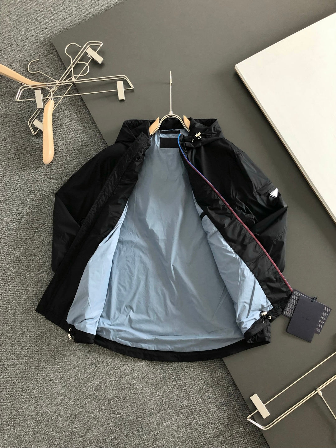 Prada black hooded jacket with light blue interior lining and zipper