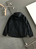 Black hooded long jacket back view with gathered collar and hood opening
