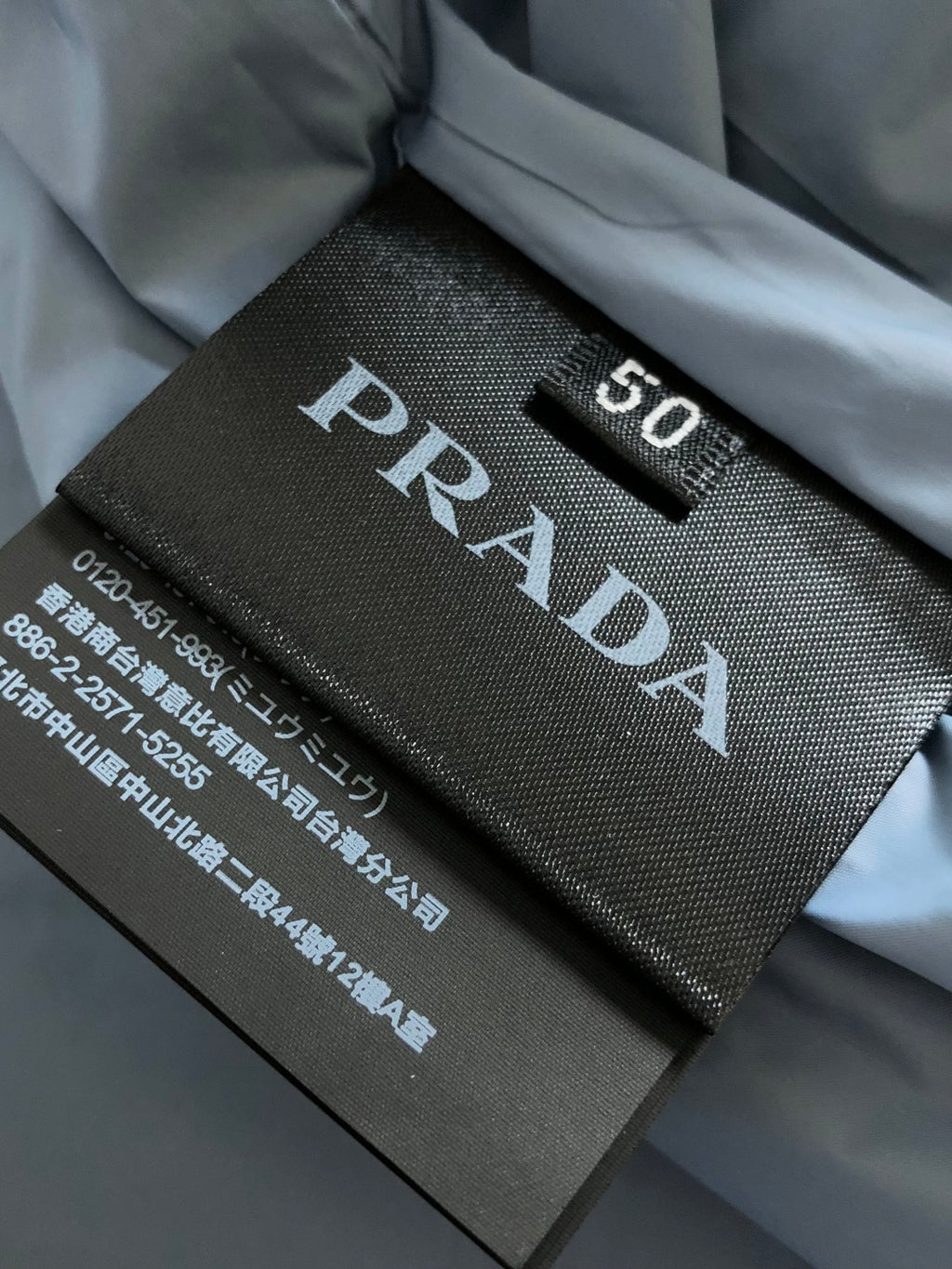 Prada size label 50 with care text on inner fabric