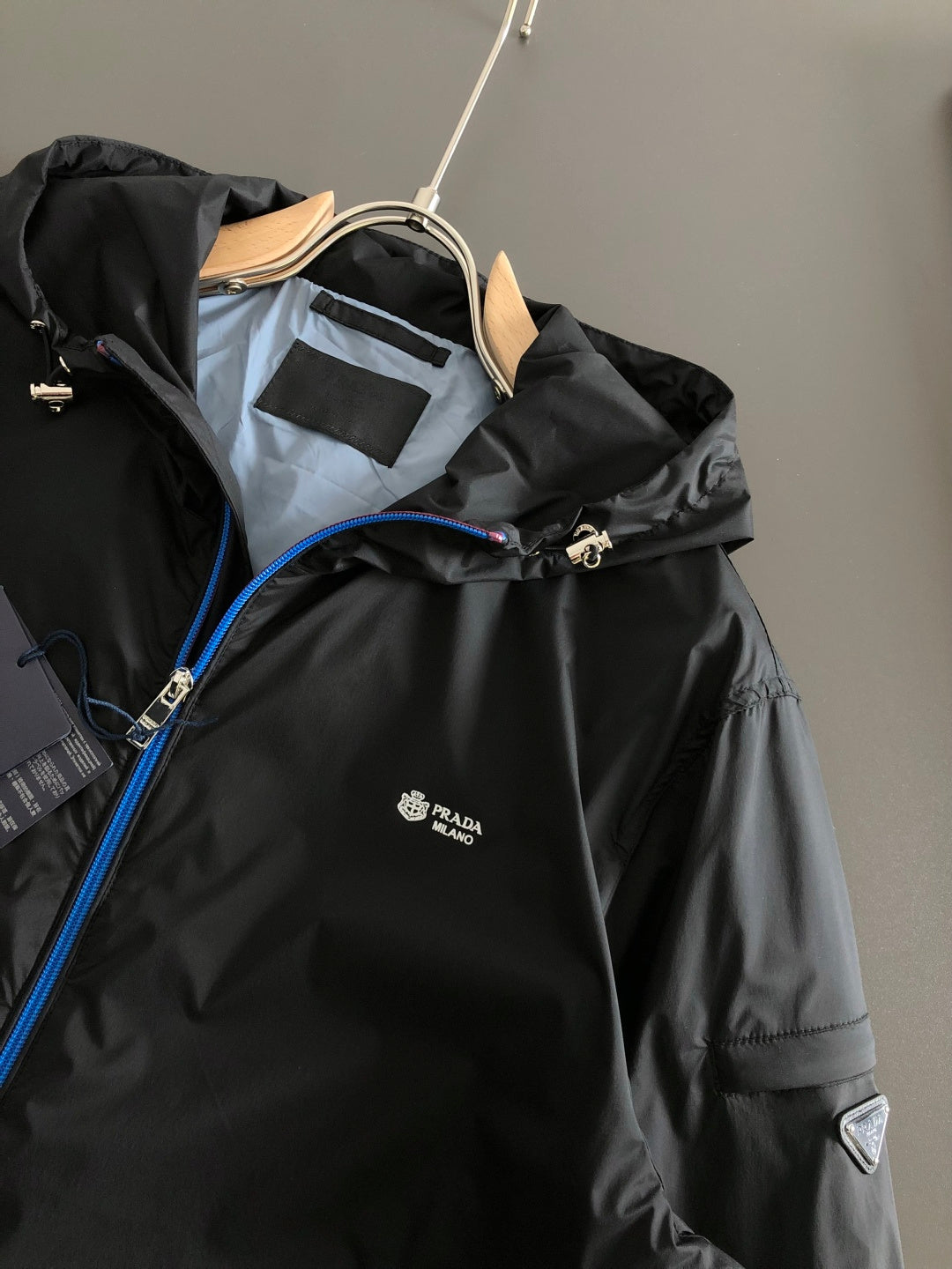Prada black hooded jacket with chest logo and blue piping