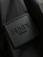 Black jacket fabric with embossed FENDI ROMA label patch