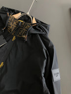 Black jacket front with hood and tan-brown FENDI logo panel detail