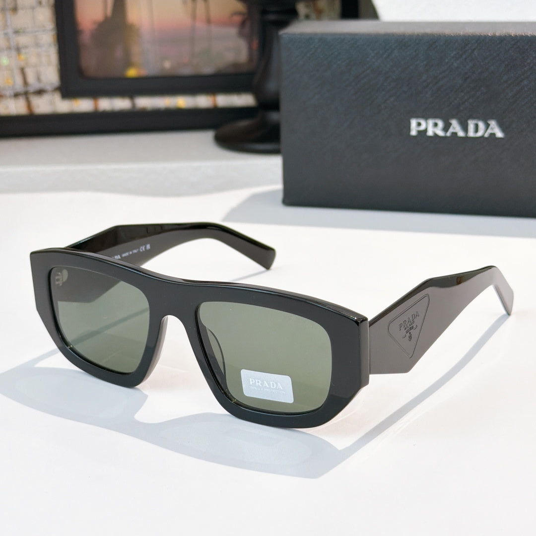 Sunglasses with black frames and light green lenses, Prada logo on temple