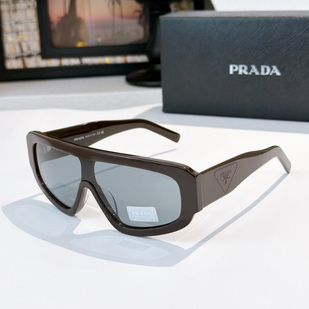 Prada sunglasses with dark brown frames and tinted lenses, angular full-rim design