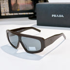 Prada sunglasses with dark brown frames and tinted lenses, angular full-rim design