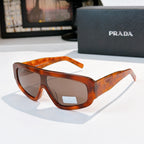 Prada sunglasses with amber tortoiseshell frames and tinted lenses, full-rim style