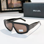 Prada sunglasses with black full-rim frames and tinted lenses, sculpted temple arms