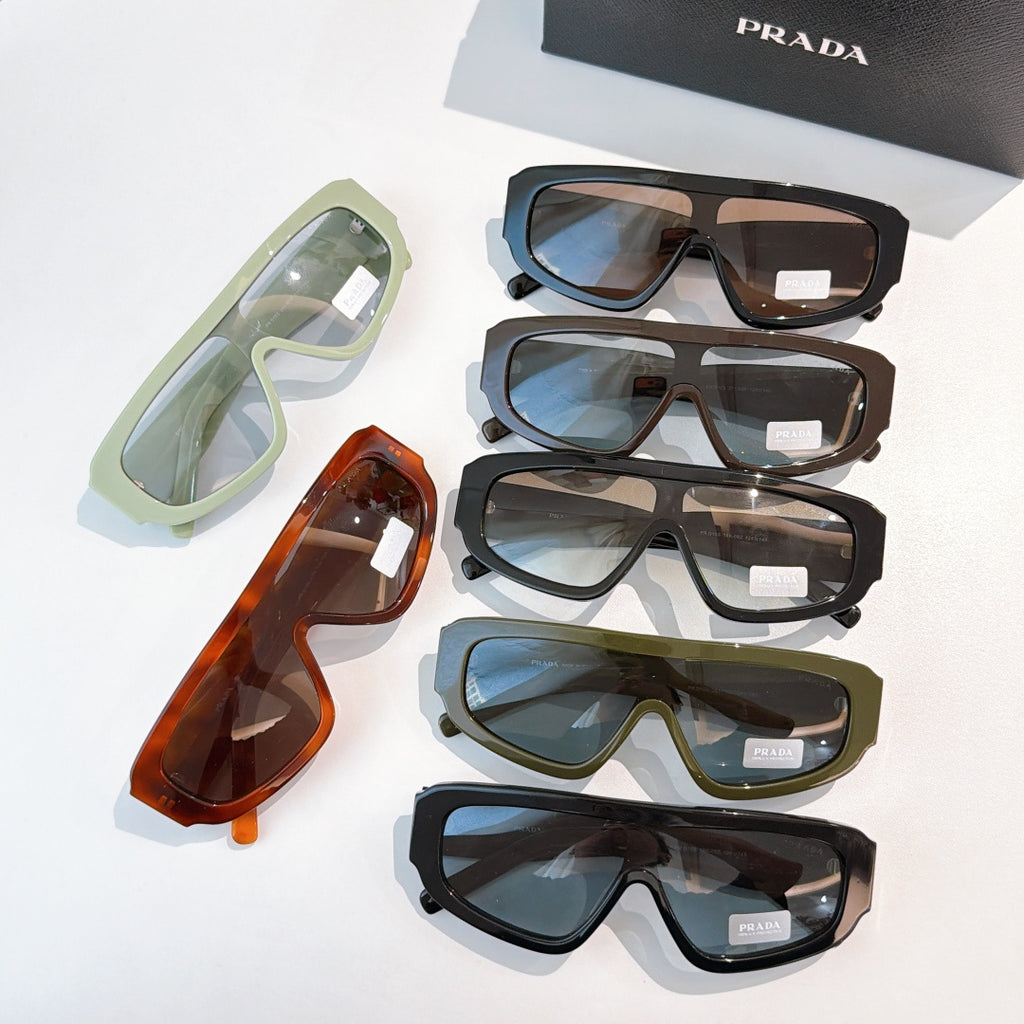 Prada sunglasses set with mint, orange, olive, and dark frames, tinted lenses