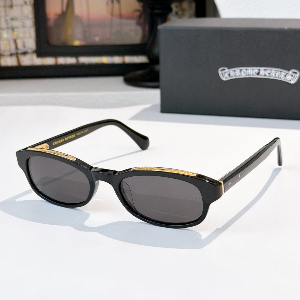Chrome-finish sunglasses with black frames and oval dark lenses