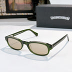 Chrome-finish glasses with green frames and oval light lenses