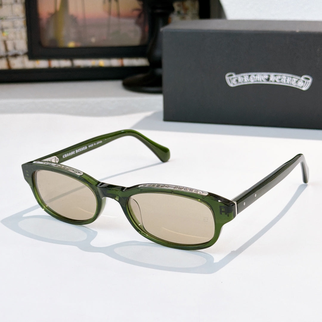 Chrome-finish glasses with green frames and oval light lenses
