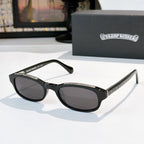 Chrome-finish sunglasses with black frames and oval dark lenses