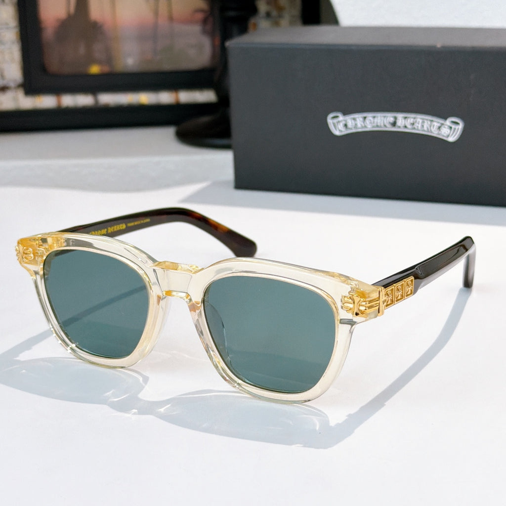 Chrome sunglasses with gold temples and teal-tinted lenses