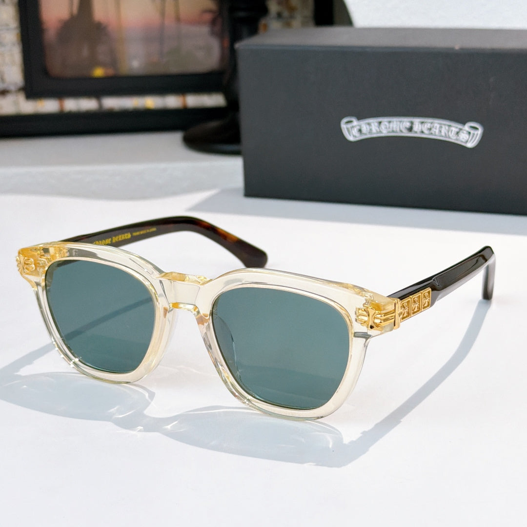 Chrome sunglasses with gold temples and teal-tinted lenses