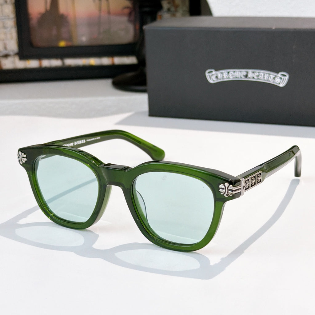 Green acetate glasses with clear lenses and silver temple logo detail