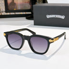 Black acetate glasses with purple-tinted lenses and gold temple emblem detail