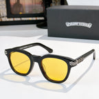 Black acetate glasses with yellow-tinted lenses and silver temple logo detail