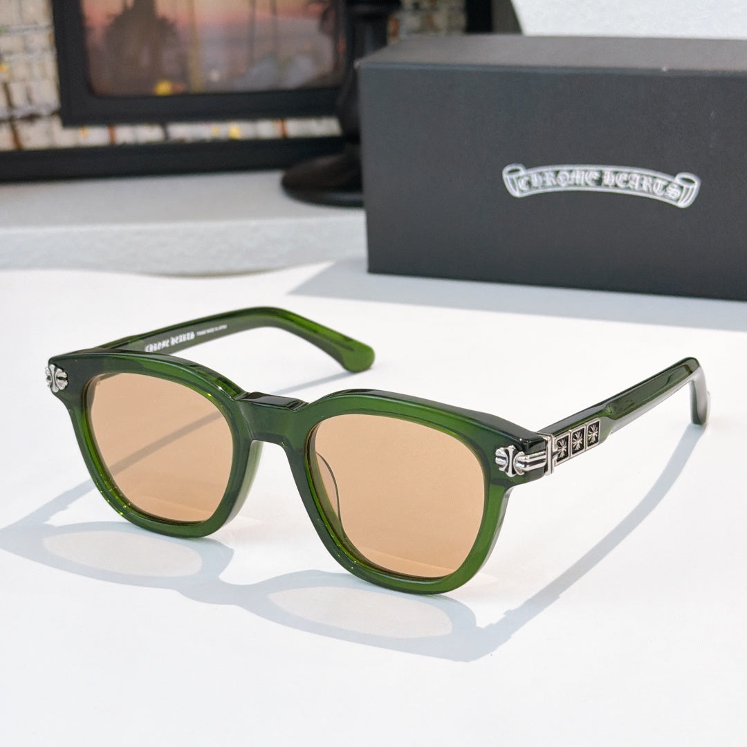 Green acetate glasses with brown-tinted lenses and silver logo detail