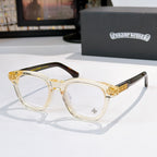Light amber acetate glasses with clear lenses and gold temple emblem detail
