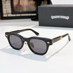 Oval sunglasses with black frame and dark gray tinted lenses, metal temples and arms.
