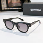 Oval sunglasses with black frame and light purple tinted lenses, metal temples and arms.