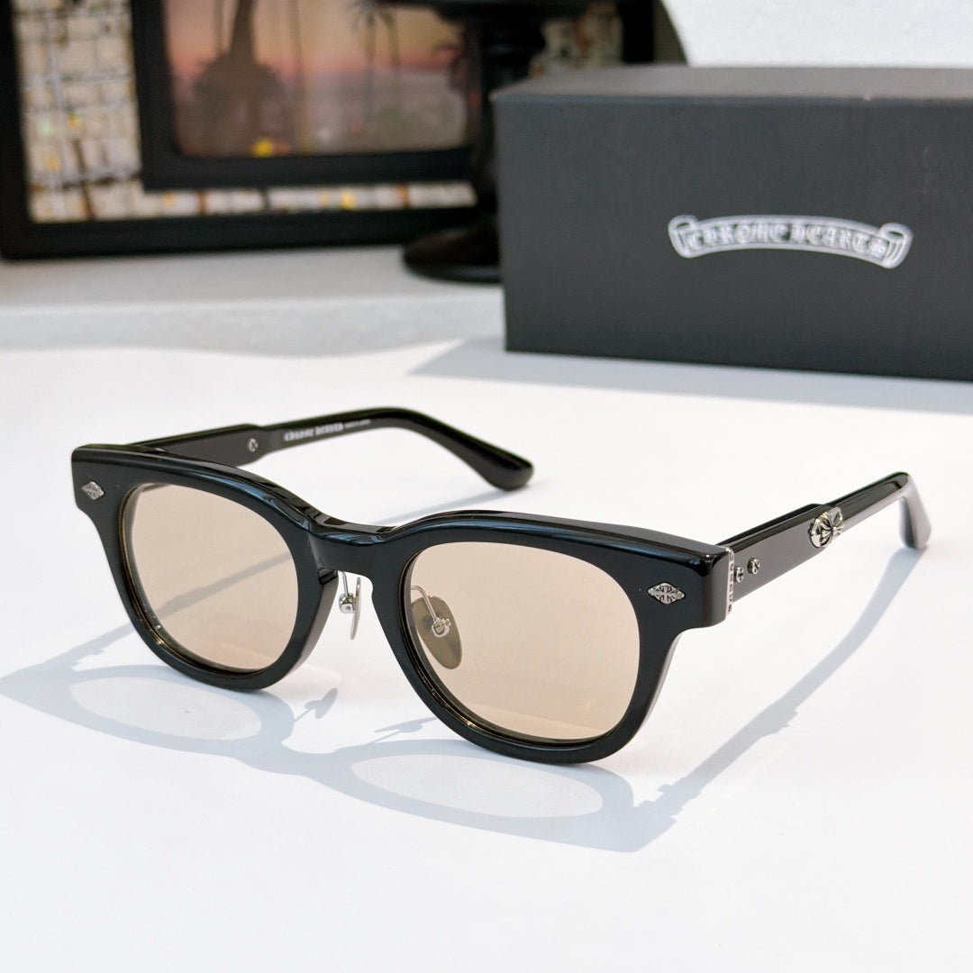 Glasses with black frames and light-tinted lenses, metal temples