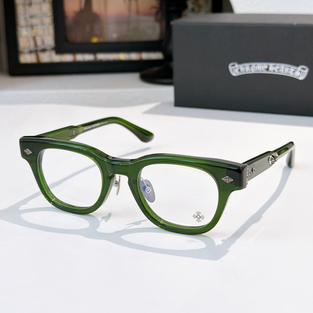 Glasses with green frames and clear lenses, metal temple arms