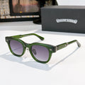 Glasses with green frames and purple-tinted lenses, metal temples